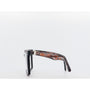 tortoiseshell frame and black lenses on a white background