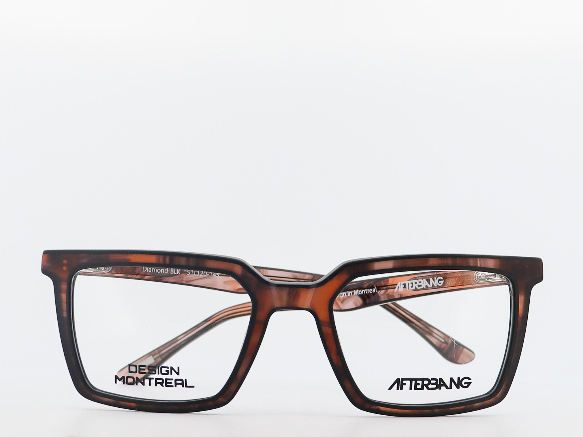 Brown eyeglasses with 'Design Montreal' and 'Aftersang' branding on a white background