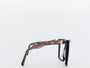 Glasses with a tortoiseshell frame on a white background