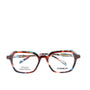 A pair of eyeglasses with a black and white patterned frame, front view.
